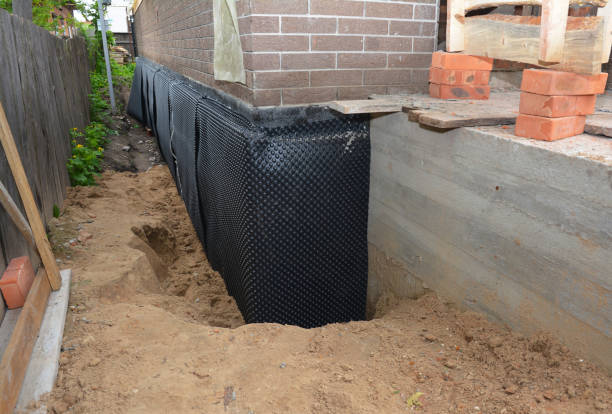 SJ Waterproofing Pros technician performing targeted Emergency Waterproofing assessment in Dresher, PA